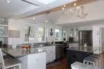 Bright kitchen with stainless appliances & counter seating